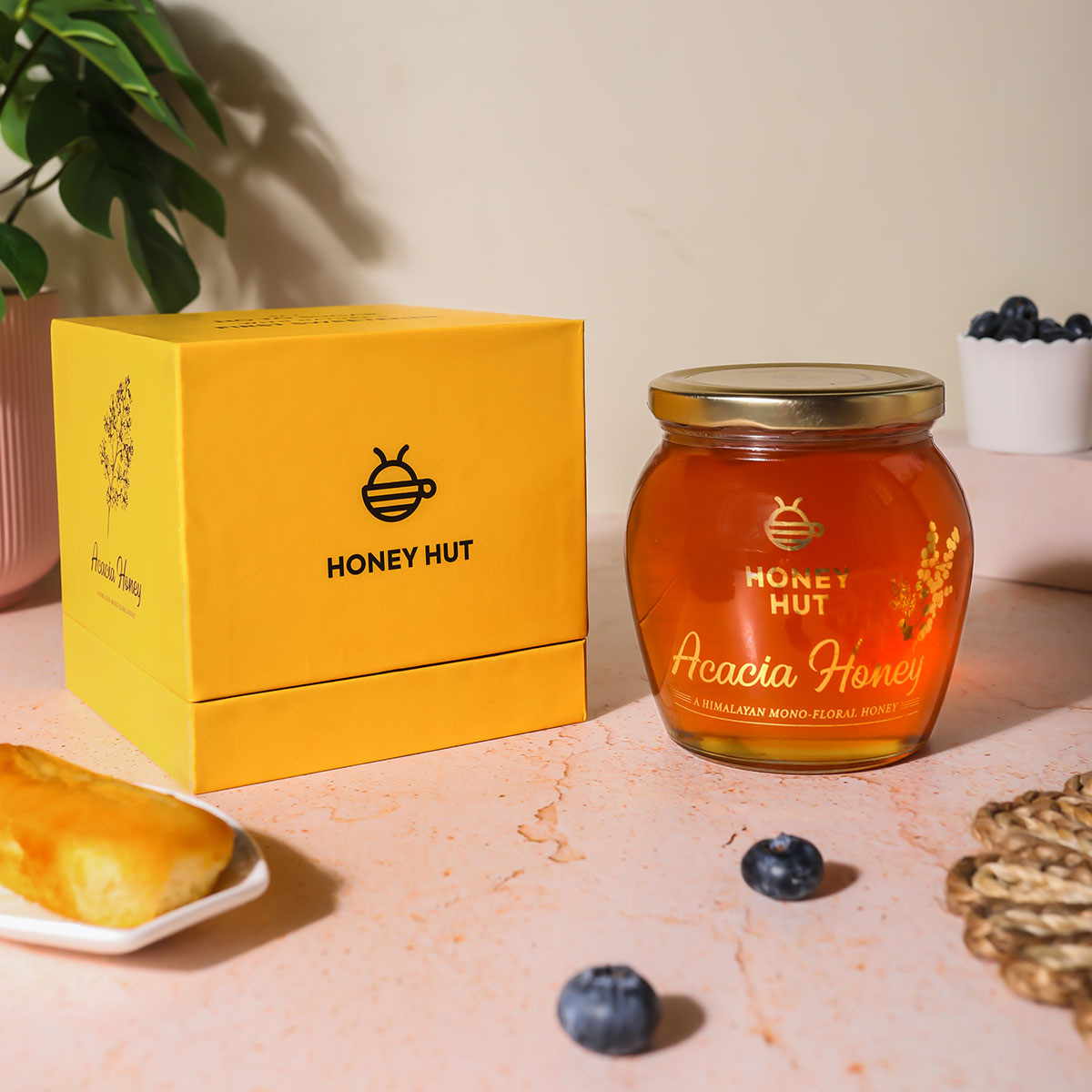 a jar of honey next to a jar of honey